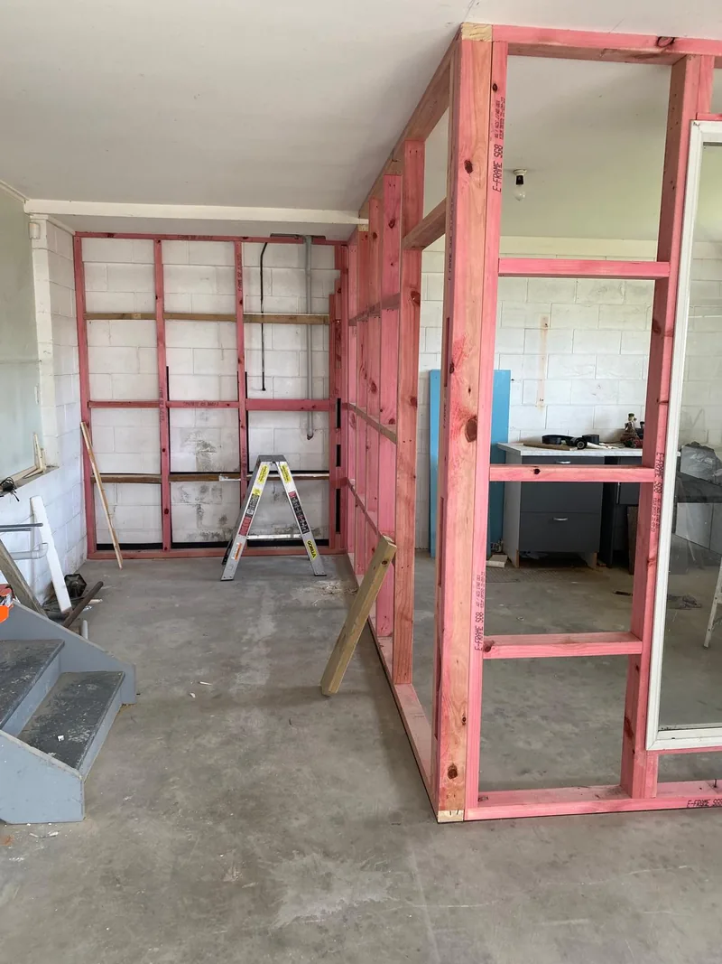 Exposed timber wall framing inside a residential renovation